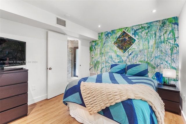 bedroom with light hardwood / wood-style floors