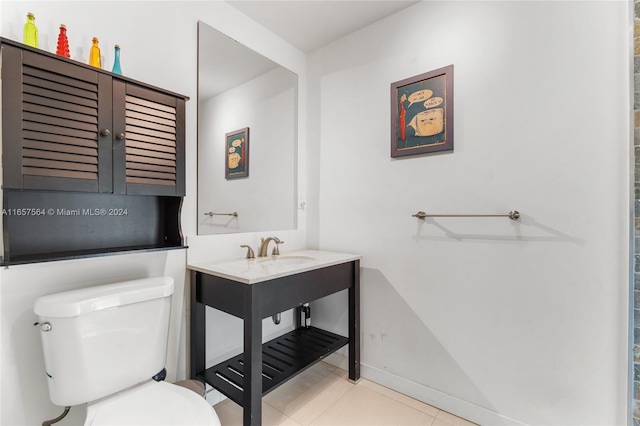 bathroom featuring tile patterned flooring and toilet