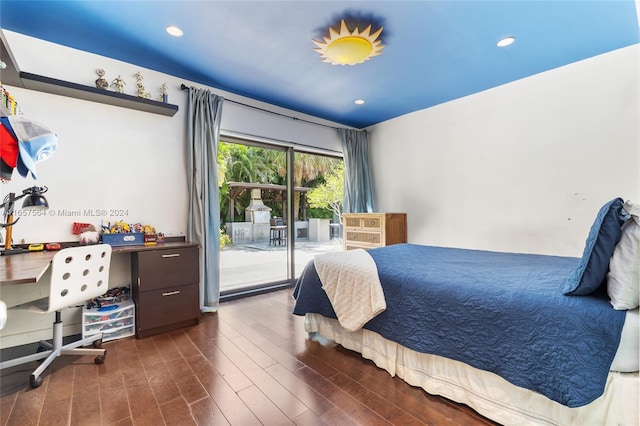 bedroom featuring dark hardwood / wood-style flooring and access to outside