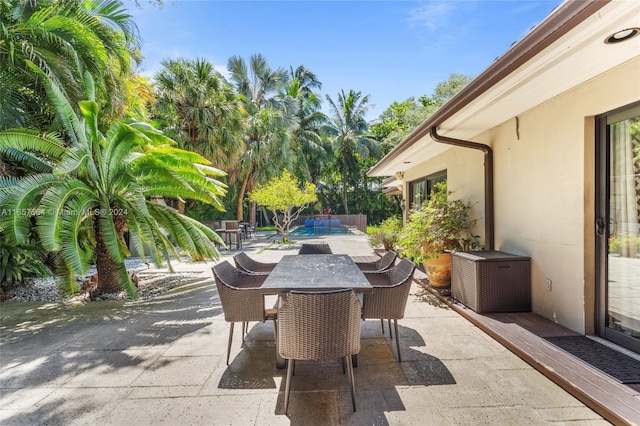 view of patio / terrace featuring a swimming pool