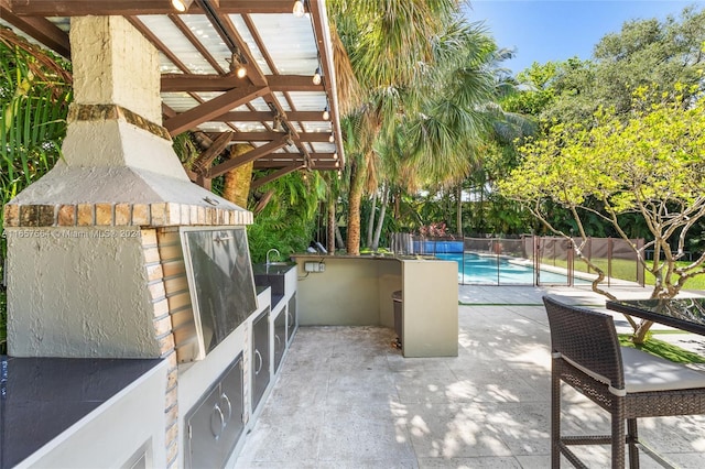 view of patio with a fenced in pool