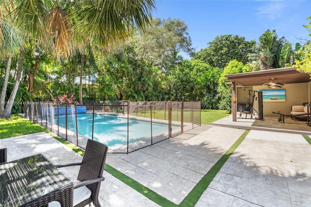 view of pool featuring ceiling fan and a patio