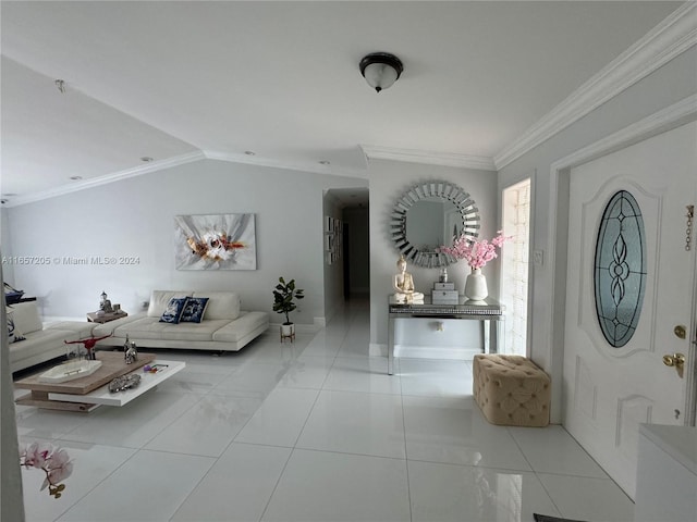 unfurnished living room with ornamental molding and light tile patterned floors