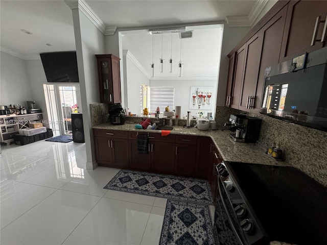 kitchen featuring tasteful backsplash, light tile patterned floors, crown molding, light stone countertops, and range with electric stovetop