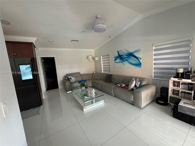 tiled living room featuring ornamental molding and lofted ceiling