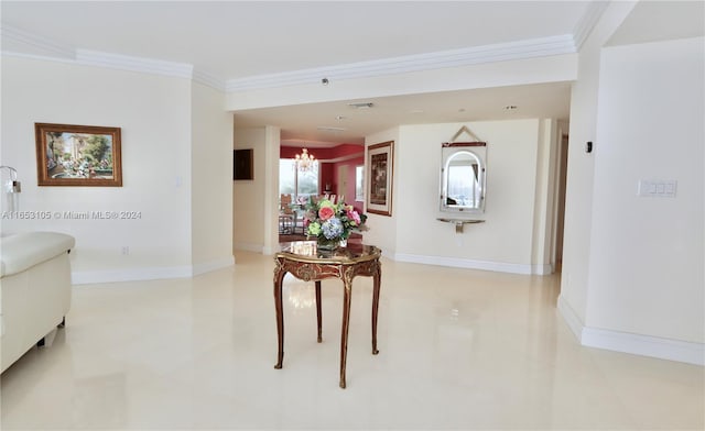 interior space with an inviting chandelier and crown molding