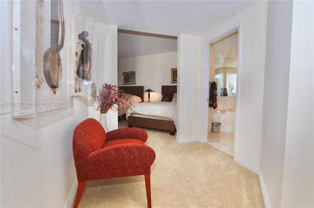 carpeted bedroom featuring connected bathroom