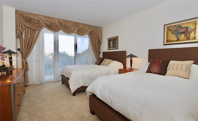 carpeted bedroom featuring access to exterior