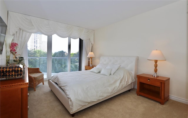 bedroom featuring light carpet