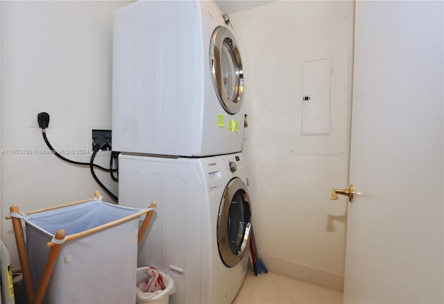 laundry area with stacked washer / dryer