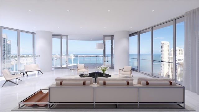 living room featuring a water view and floor to ceiling windows