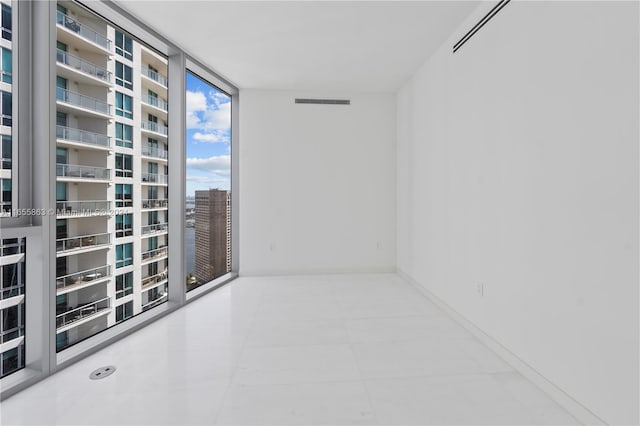 empty room featuring floor to ceiling windows