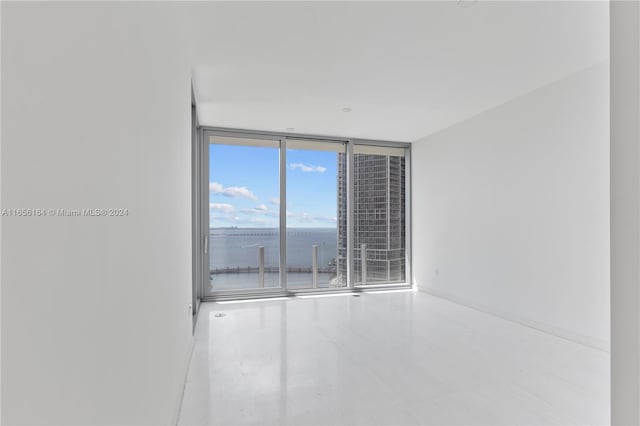 300 Biscayne Blvd Way Unit 2503, Miami, FL 33131 - empty room with a wall of windows, baseboards, and a water view
