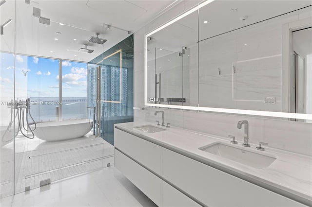 bathroom with vanity, expansive windows, separate shower and tub, and tile patterned floors