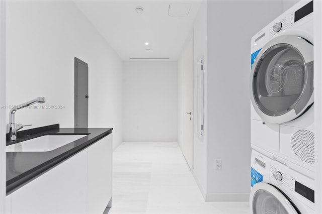 300 Biscayne Blvd Way Unit 2503, Miami, FL 33131 - laundry area featuring estacked washer and dryer and cabinet space