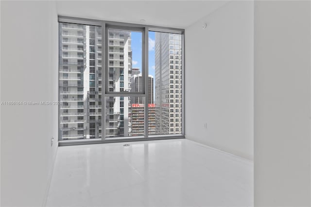 300 Biscayne Blvd Way Unit 2503, Miami, FL 33131 - tiled empty room featuring floor to ceiling windows and a city view