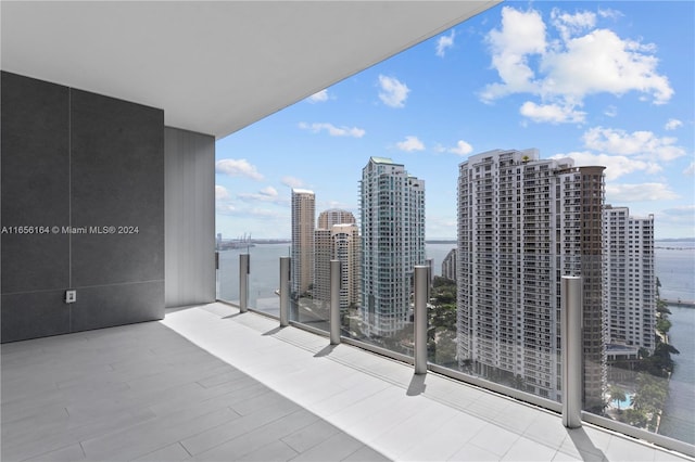 balcony featuring a water view