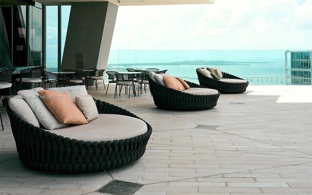 view of patio with a water view