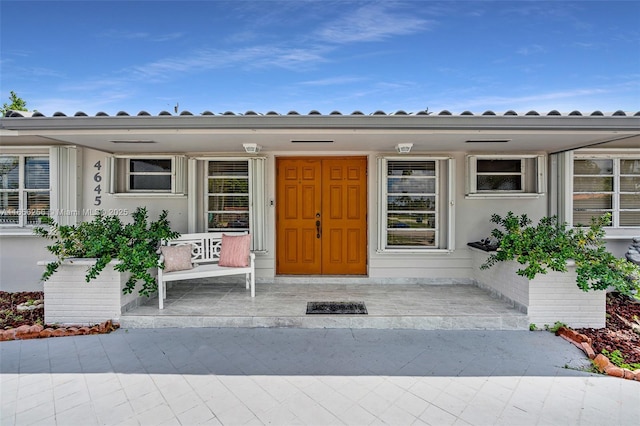 doorway to property featuring a porch