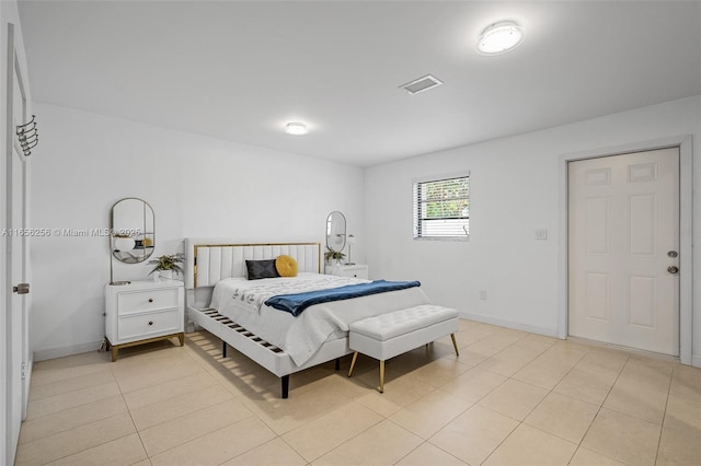 bedroom featuring light tile patterned floors