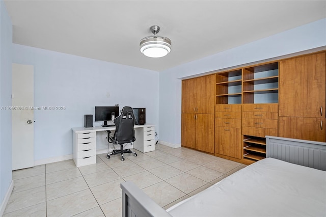 tiled bedroom featuring a closet