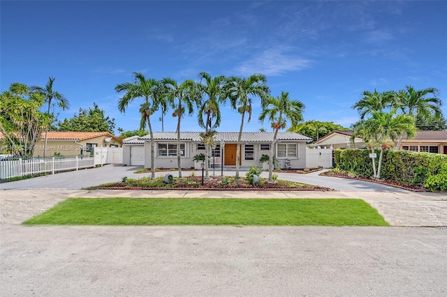 ranch-style house featuring a garage