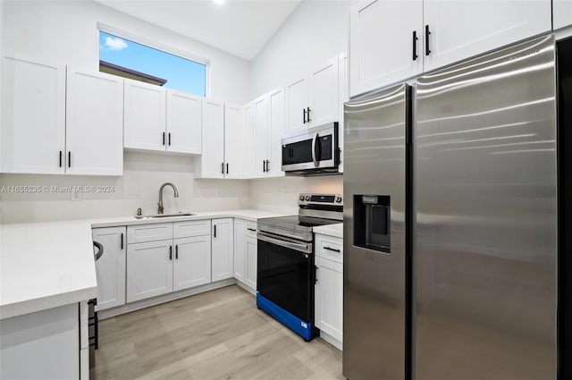 kitchen featuring sink, light wood-type flooring, white cabinetry, and stainless steel appliances