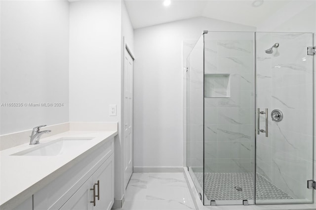 bathroom with vanity, an enclosed shower, and lofted ceiling