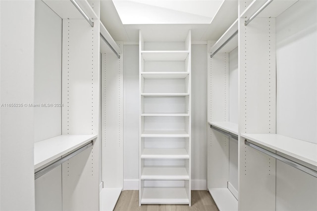 spacious closet featuring light wood-type flooring