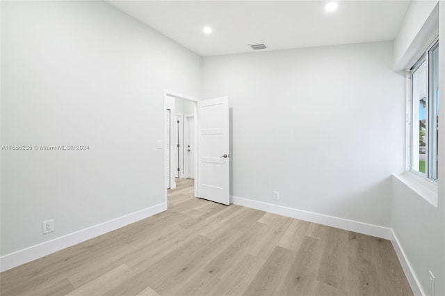 spare room with light wood-type flooring