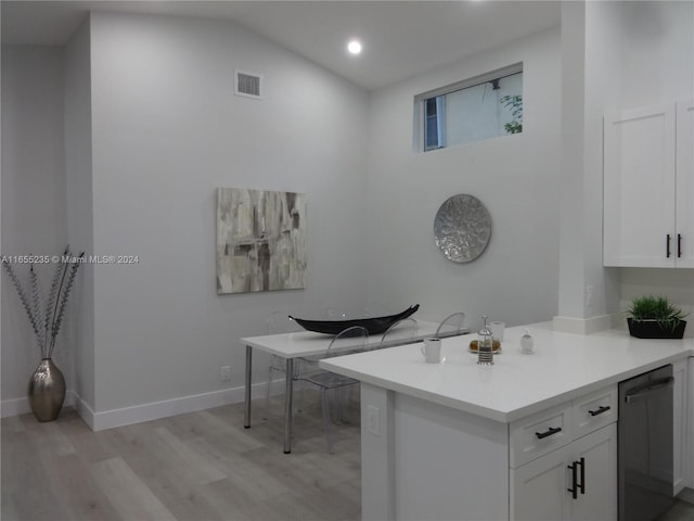 bathroom featuring wood-type flooring and lofted ceiling