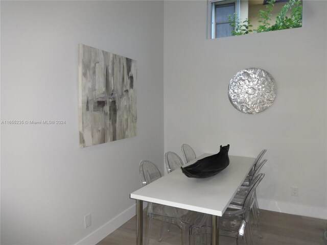 dining space featuring hardwood / wood-style floors