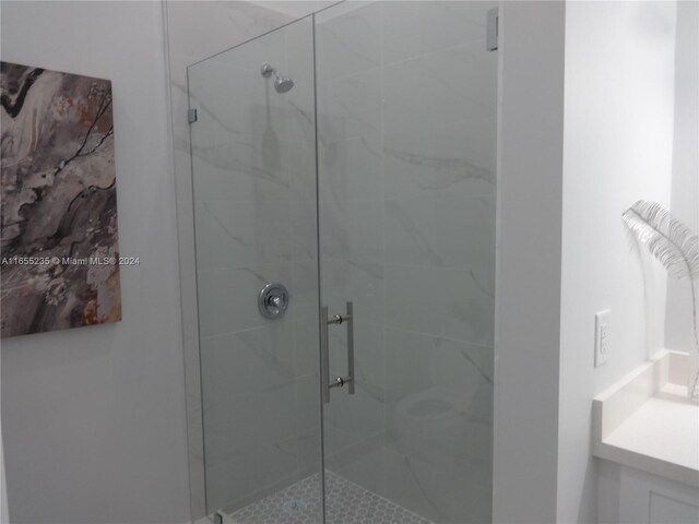 bathroom with vanity and an enclosed shower