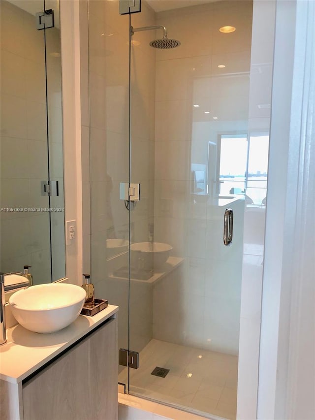 bathroom with vanity and an enclosed shower