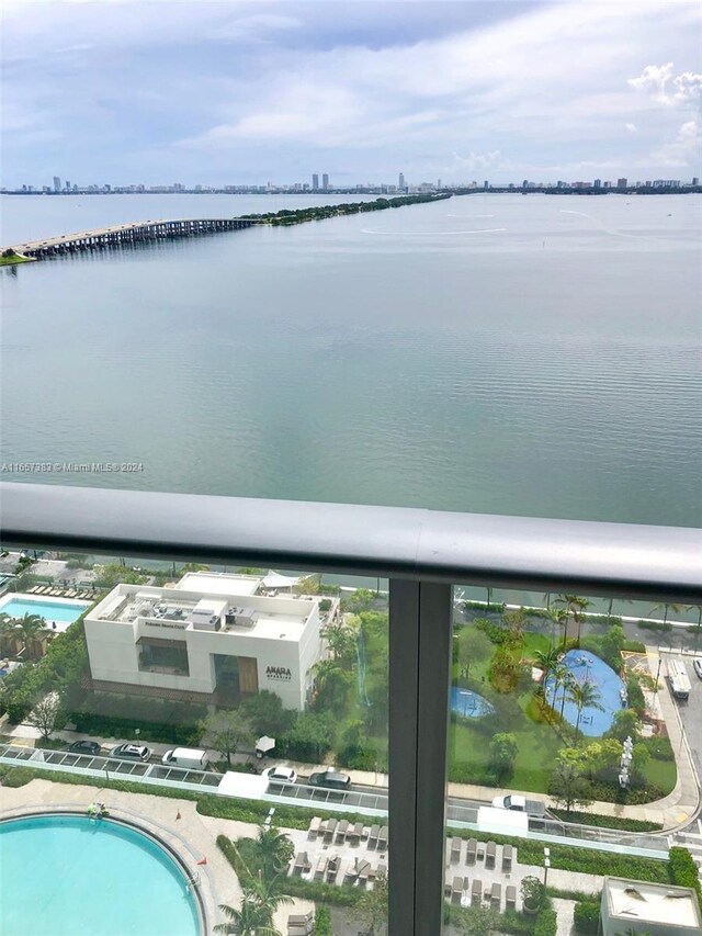 birds eye view of property featuring a water view