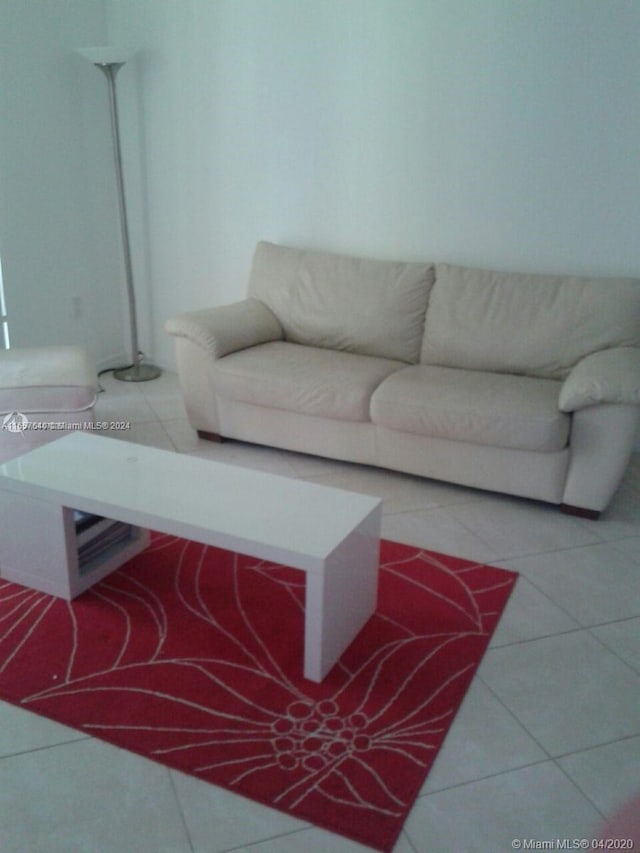 unfurnished living room featuring light tile patterned flooring