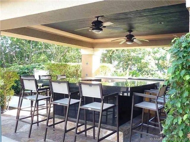 view of patio featuring ceiling fan