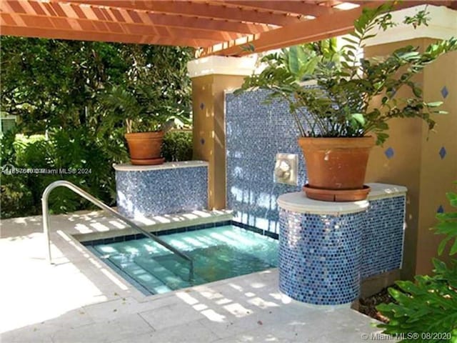 view of pool featuring a patio and a pergola