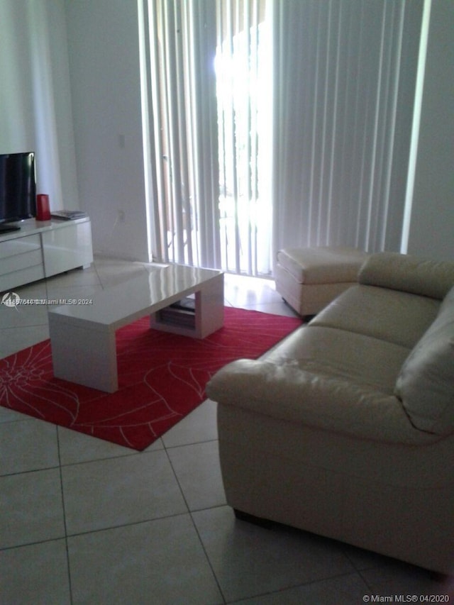 living room with tile patterned flooring