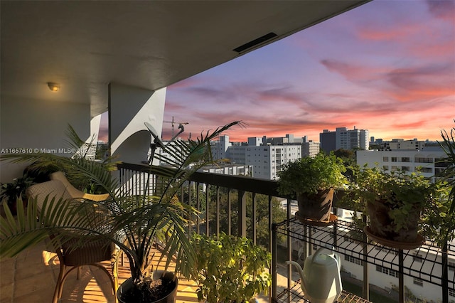 view of balcony at dusk