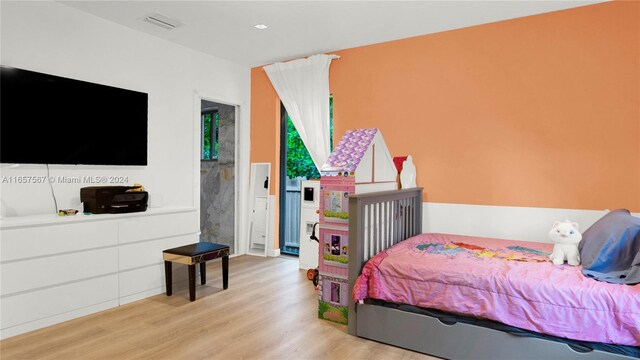 bedroom with light hardwood / wood-style floors