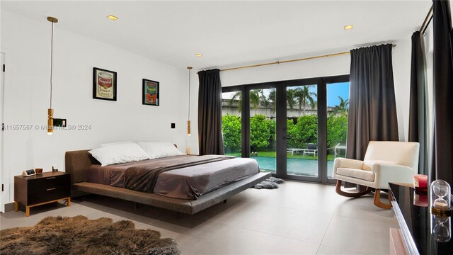 bedroom featuring access to exterior and french doors