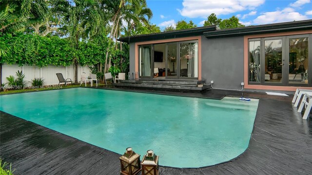 view of pool with a wooden deck