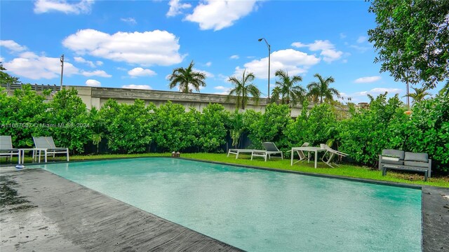 view of swimming pool with a patio