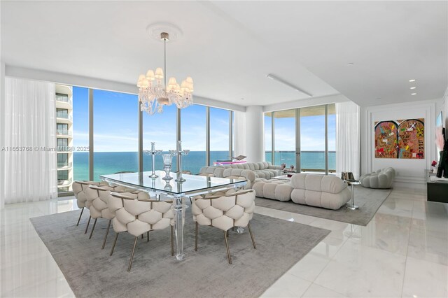 living room featuring floor to ceiling windows, ornamental molding, light tile patterned floors, and a water view