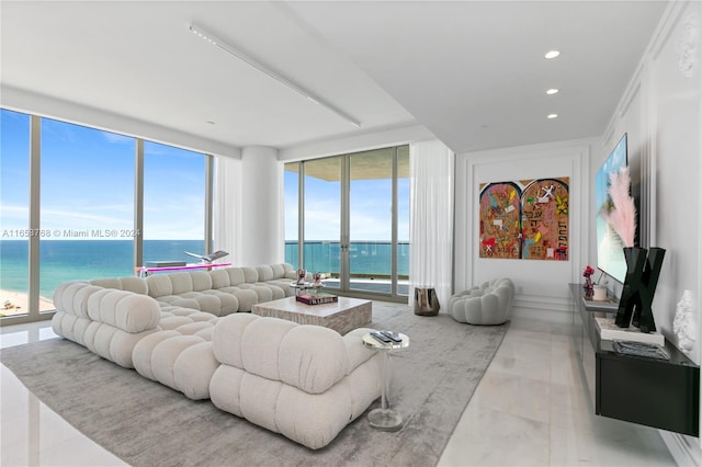 tiled living area featuring a wall of windows, recessed lighting, and a healthy amount of sunlight