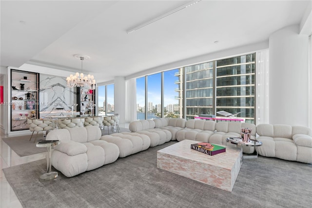 living room with a view of city and a chandelier