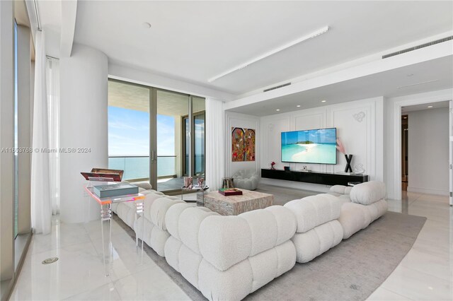 living room featuring floor to ceiling windows