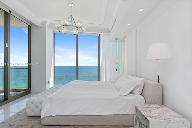 bedroom with crown molding, multiple windows, a water view, and access to exterior