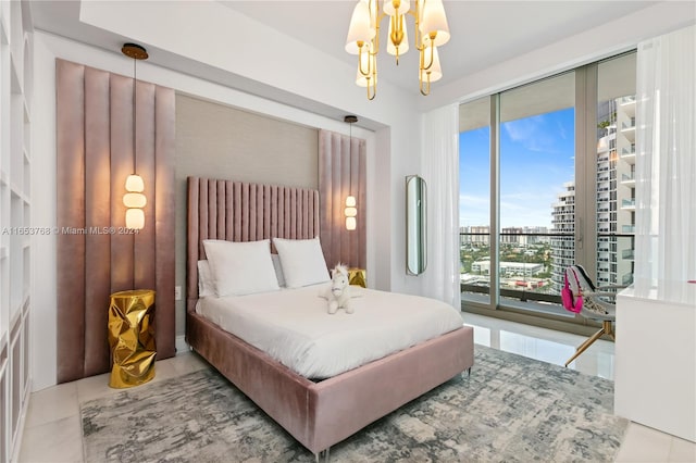 tiled bedroom featuring access to outside and a chandelier